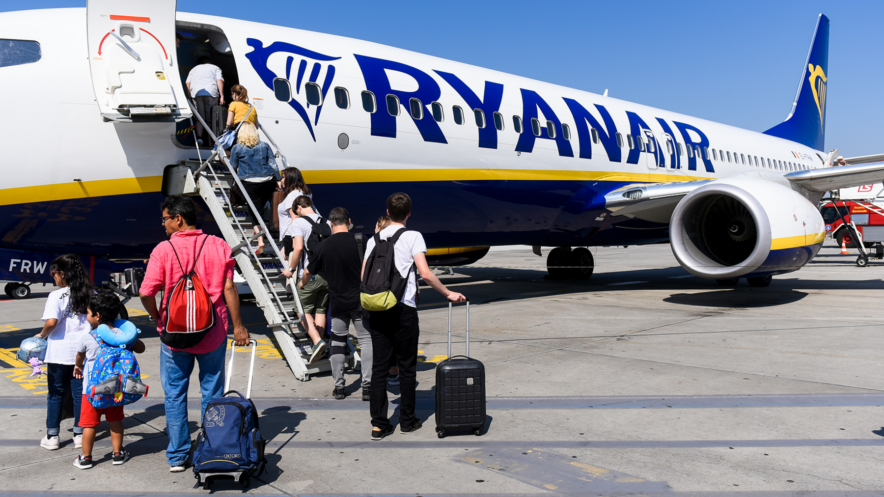 Ryanair says it will reluctantly let parents sit with children for free