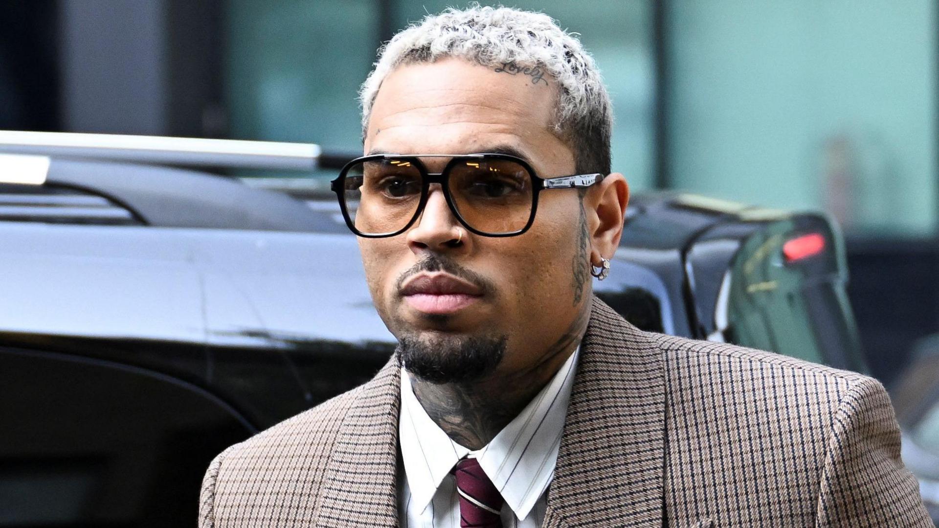 Chris Brown ordered to pay housekeeper $13m after dog attack