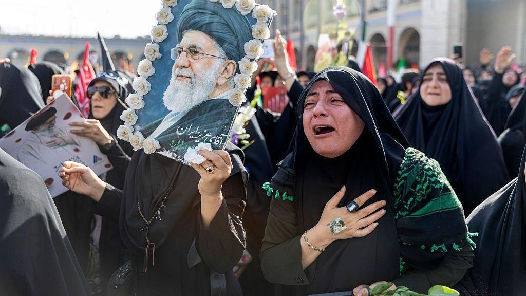 Iran’s supreme leader absent as senior officials attend ayatollah’s funeral