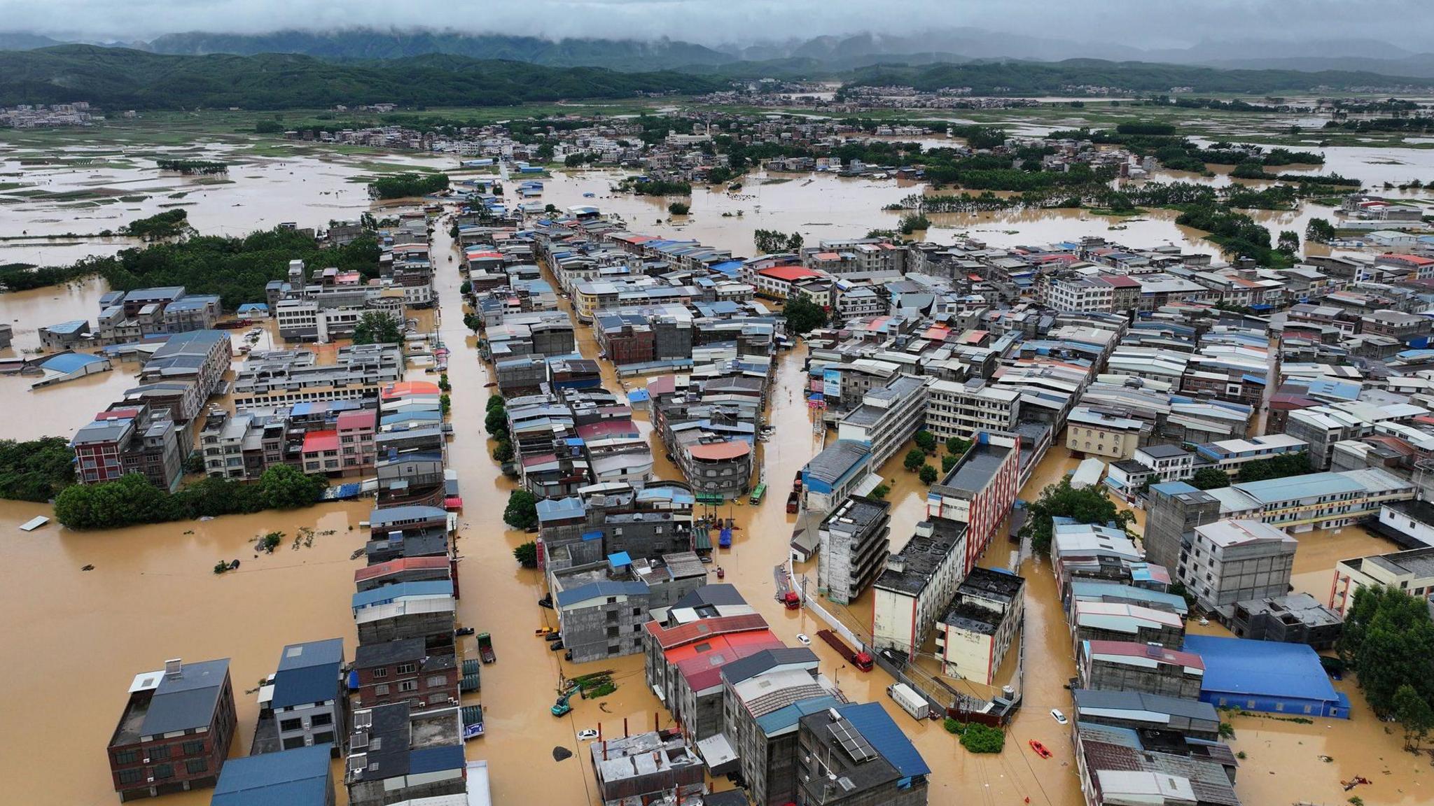‘The water just came so fast’: Typhoon triggers floods and rare tornadoes in China