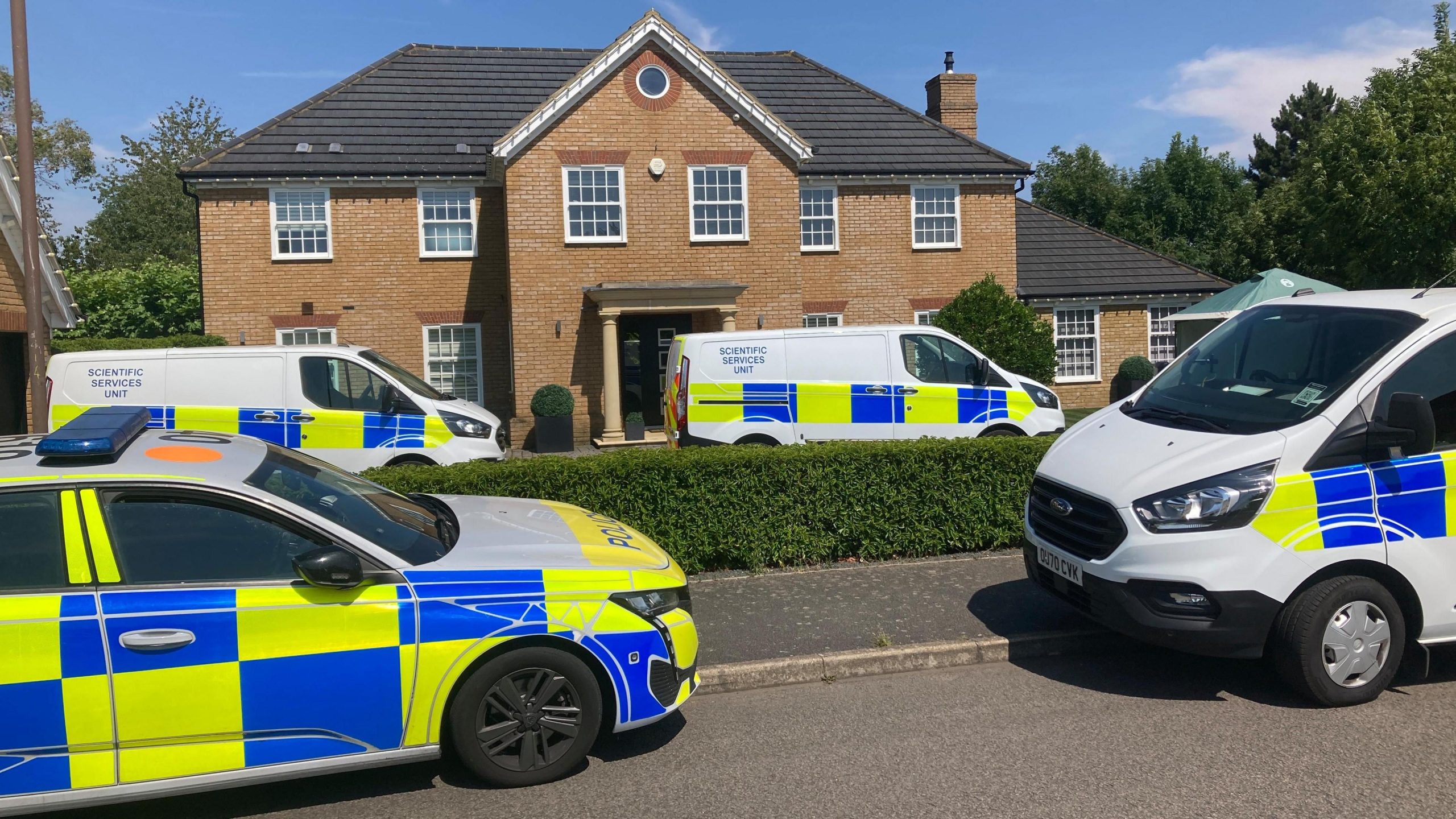 Murder inquiry after mother and children found dead