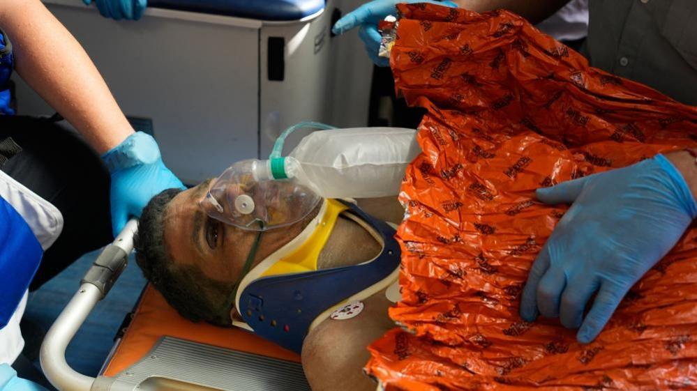 Venezuela quake survivor pulled out alive after eight days