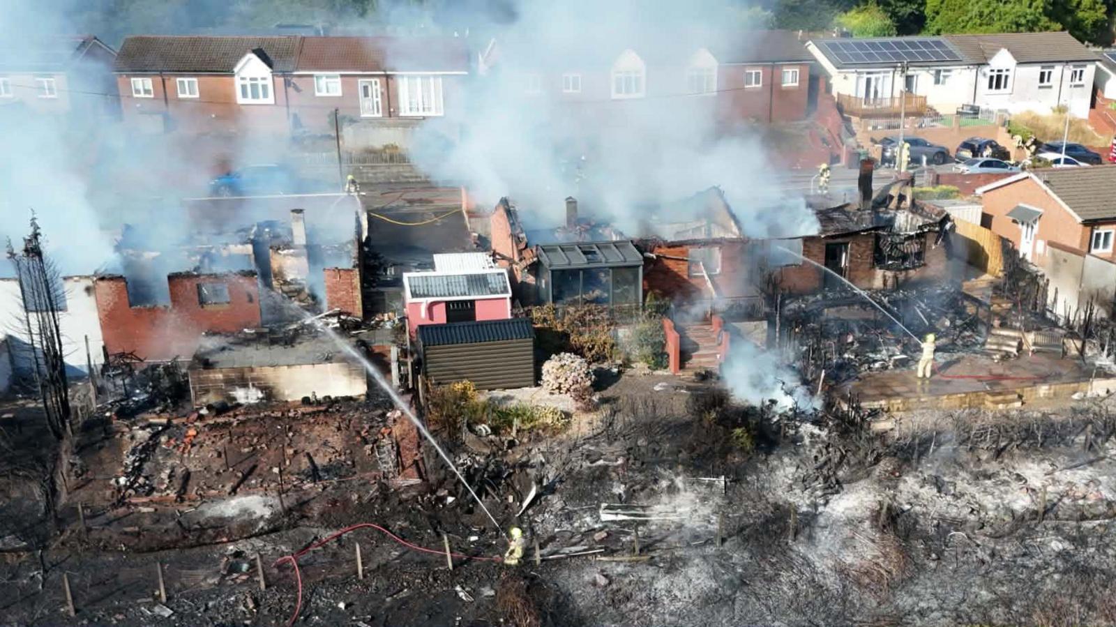 Streets evacuated after massive fire destroys homes